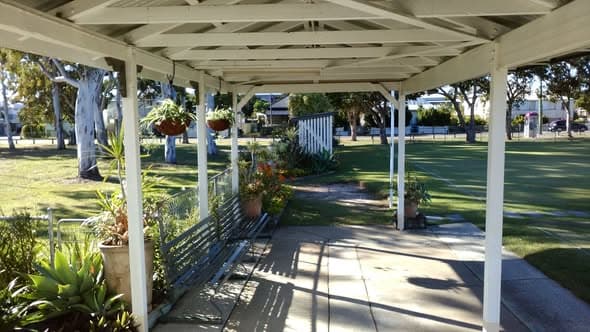 Toombul's Agave flowers again as tree shadows fall across clubhouse and lawns
