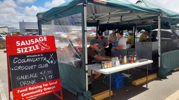 Members volunteer at Coolangatta sausage sizzle