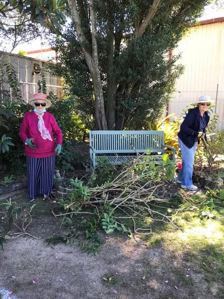 Working bee tackles gardens and new shed