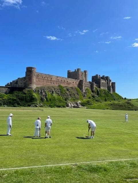 Croquet under Bamburgh Castle in England
