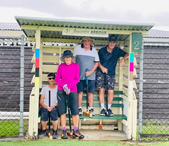 Graceville members enjoy the game despite wet start