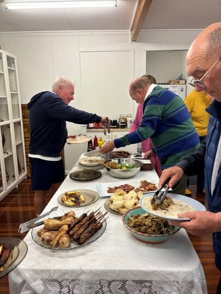 Monthly Friday night BBQ brings members together for croquet