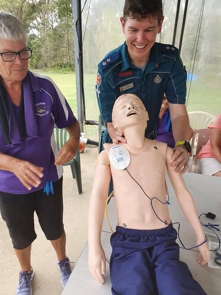 Young Brody demonstrates the defibrillator